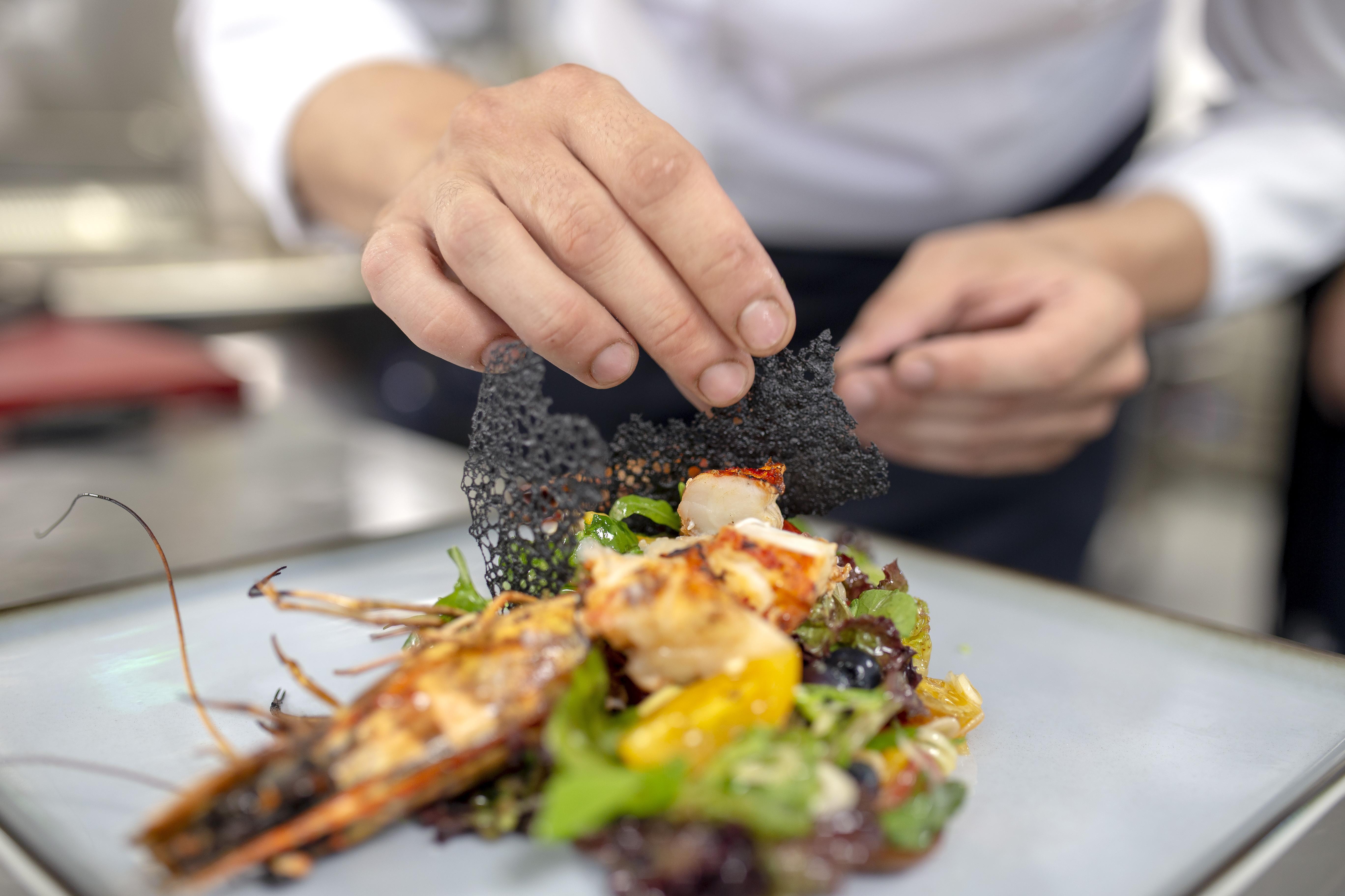 Huma Kotor Bay Hotel And Villas Экстерьер фото A chef finishing a plate of food